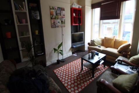 A spacious living room featuring comfortable se...