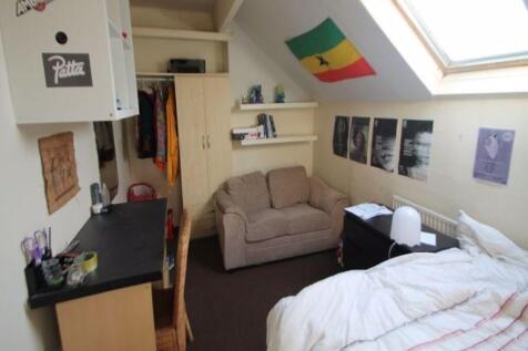 A bright and cozy living space featuring a comf...