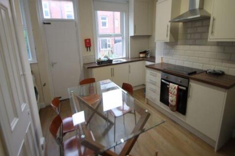 A bright and tidy kitchen with ample natural li...