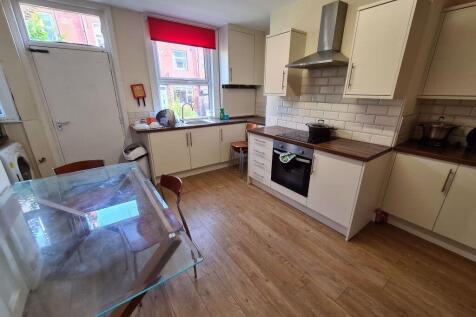 Bright and well-maintained kitchen with ample n...