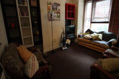 A cozy living room with a comfortable sofa, a s...