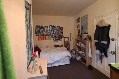 A cozy bedroom with a double bed, clutter-free ...