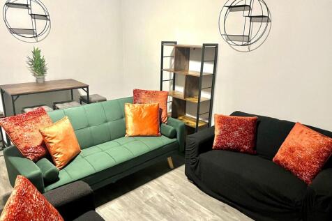 A stylish and inviting living room featuring a ...