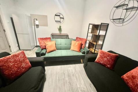 A modern and inviting living room featuring com...