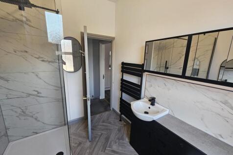 Modern and clean bathroom with a spacious sink ...