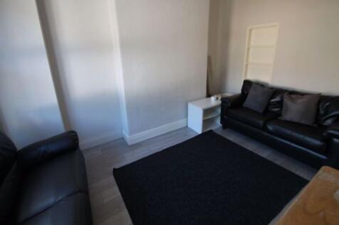 A modern and stylish living room featuring comf...