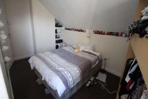 A spacious master bedroom featuring a large dou...