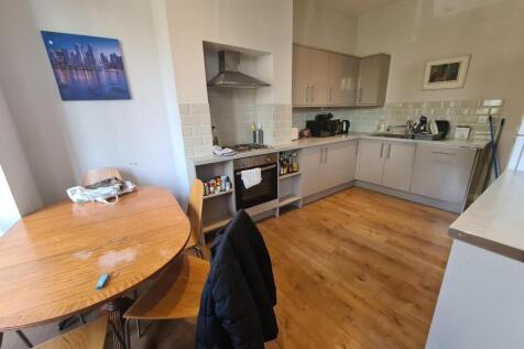 Bright and modern kitchen featuring ample count...