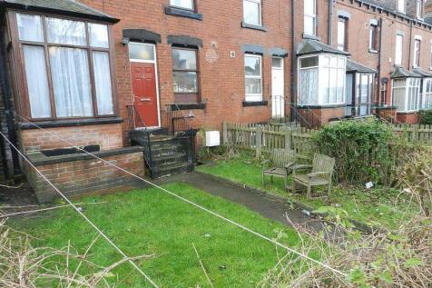 Front view of a traditional terraced house feat...