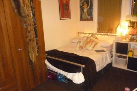 A well-presented master bedroom featuring a lar...