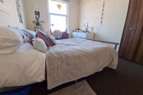 A spacious and well-maintained master bedroom f...