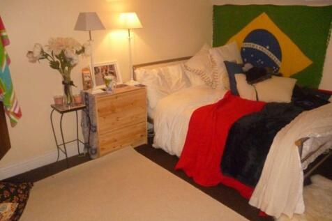 A spacious and well-maintained bedroom featurin...