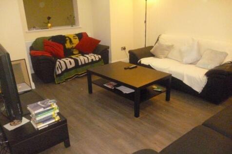 Modern living room featuring two sofas, a coffe...