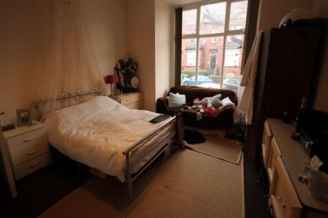 A spacious and inviting master bedroom with a l...