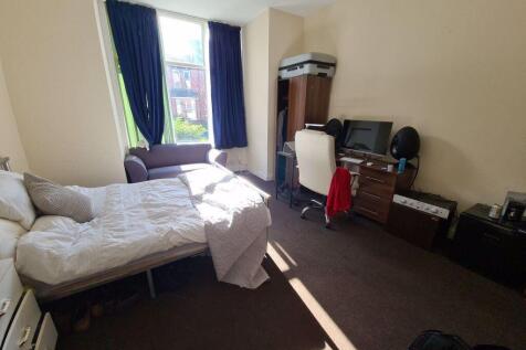 A welcoming bedroom featuring a double bed and ...