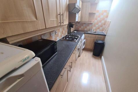 A well-maintained kitchen with ample workspace ...