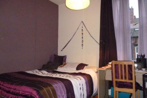 A cozy bedroom featuring a double bed with deco...