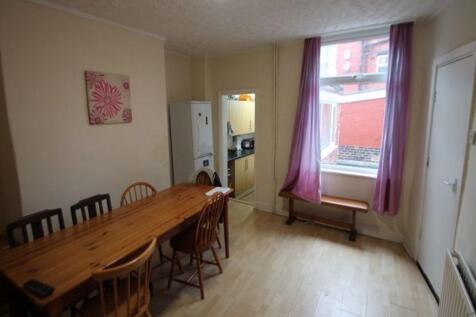 Bright and welcoming living room with a large w...