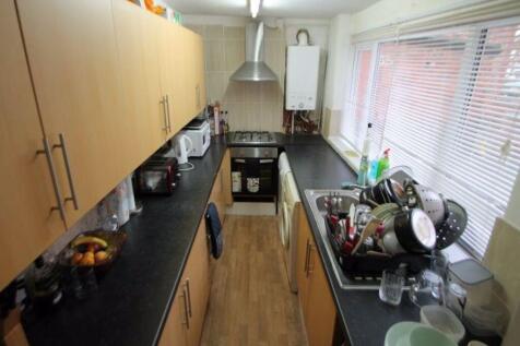 A bright and well-organized kitchen with modern...
