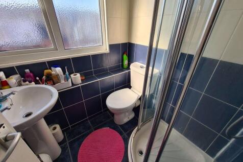 A well-maintained bathroom featuring a standard...