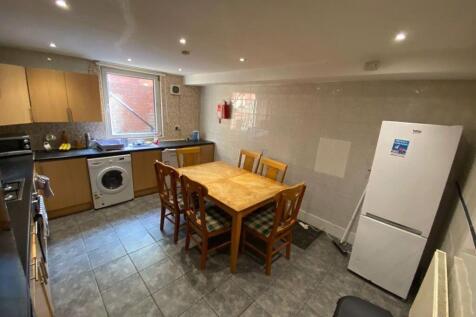 Modern kitchen featuring ample counter space, w...