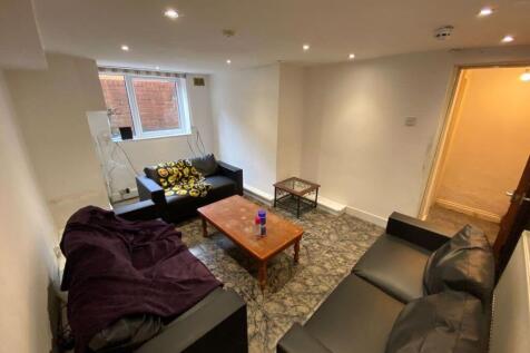 Bright and cozy living room featuring comfortab...