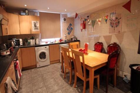 A warm and inviting kitchen featuring a wooden ...