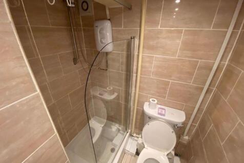Modern bathroom featuring a clear glass shower ...