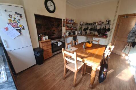 A bright and welcoming living room featuring a ...