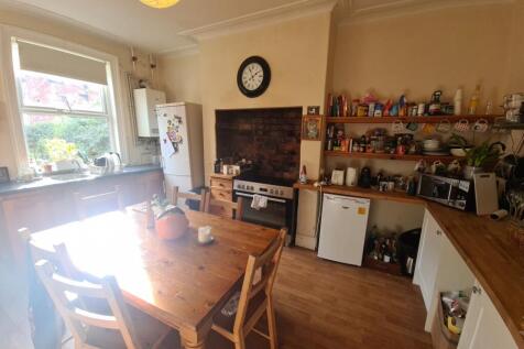 Bright and welcoming living room with ample nat...