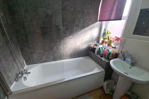 A clean and well-maintained bathroom featuring ...
