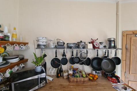 A well-organized kitchen area with a variety of...