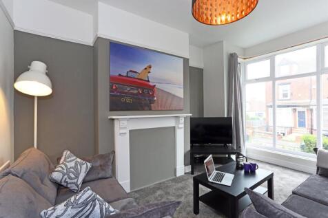 A bright and inviting living room featuring a l...