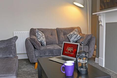 A cozy and inviting living room featuring comfo...