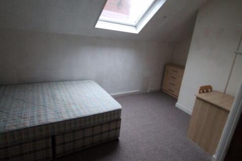 A simple, quiet double bedroom featuring a larg...