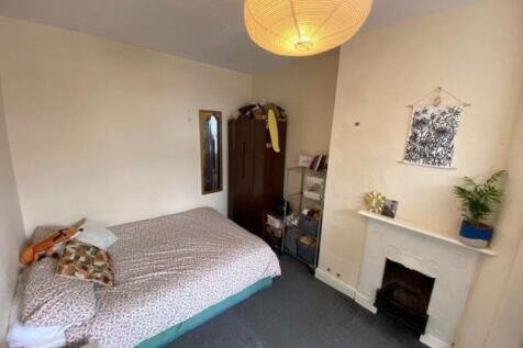 Bright and cozy double bedroom featuring a comf...