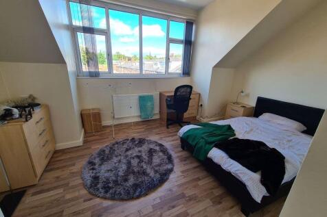 Bright and airy double bedroom featuring a comf...
