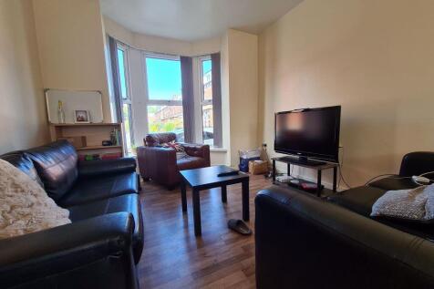 A cozy and inviting living room featuring comfo...