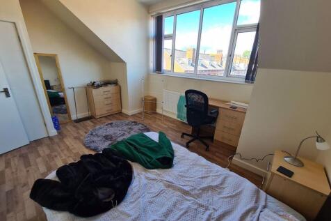 Bright and tidy room with a large window allowi...