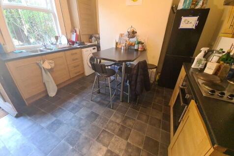 A well-maintained kitchen with natural light st...