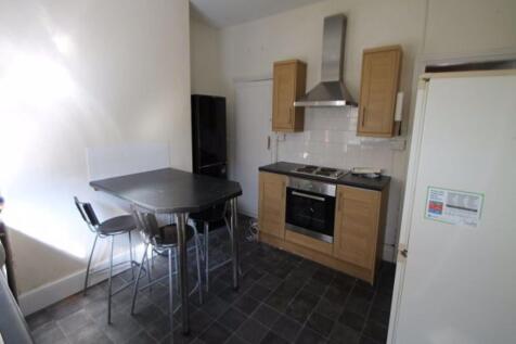 A modern, well-maintained kitchen area with amp...