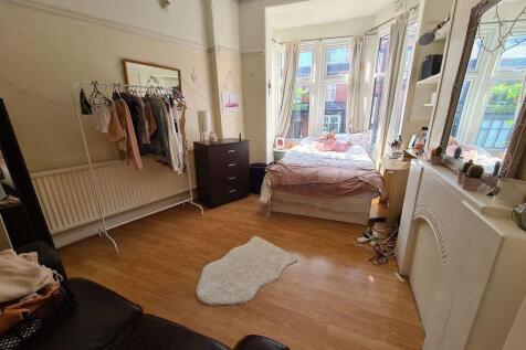 Bright and spacious master bedroom featuring a ...