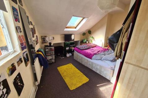 Bright and cozy double bedroom featuring a comf...