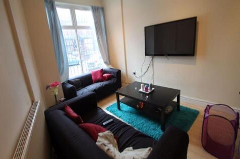 A modern, well-lit living room featuring comfor...