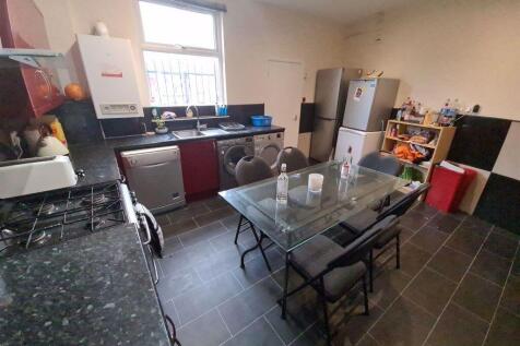 A spacious and modern living room featuring a g...