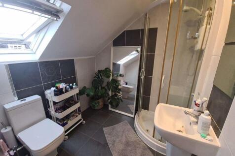 A modern, clean bathroom suite featuring a spac...