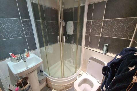 A clean and modern bathroom featuring a spaciou...