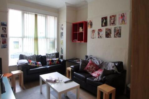 Bright and inviting living room featuring comfo...