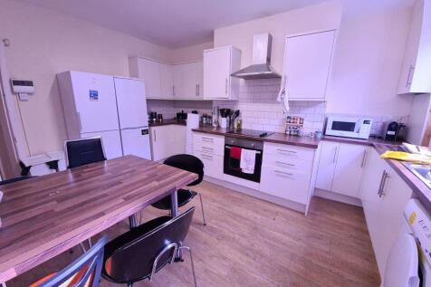 A bright and modern kitchen with ample workspac...