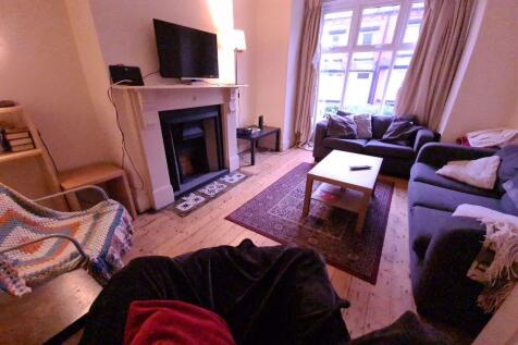 A cozy and inviting living room with comfortabl...